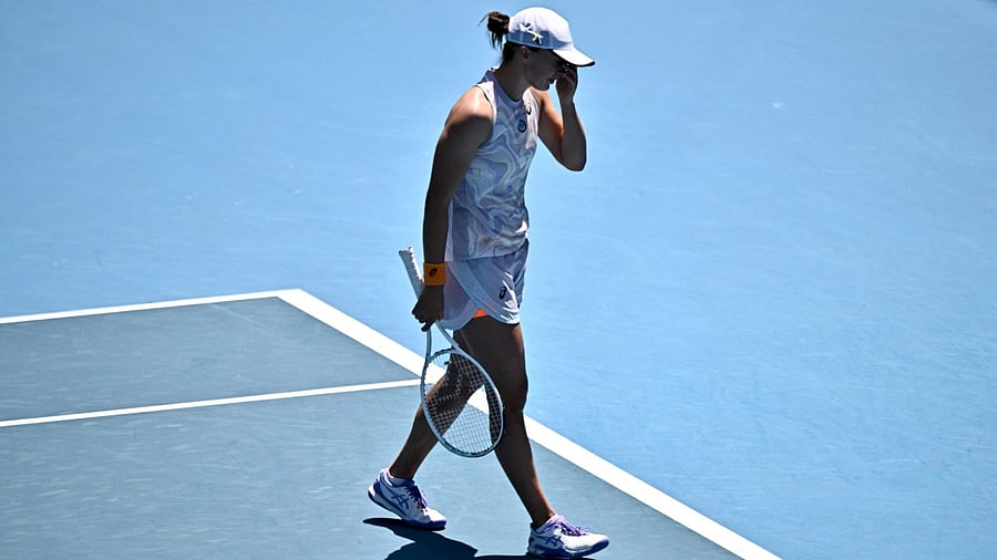 Poland's Iga Swiatek reacts after losing a point against Kazakhstan's Elena Rybakina during their women's singles match on day seven of the Australian Open tennis tournament in Melbourne on January 22, 2023. Credit: AFP Photo