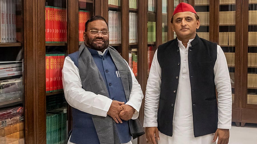 Swami Prasad Maurya (L) with party chief Akhilesh Yadav (R). Credit: PTI Photo