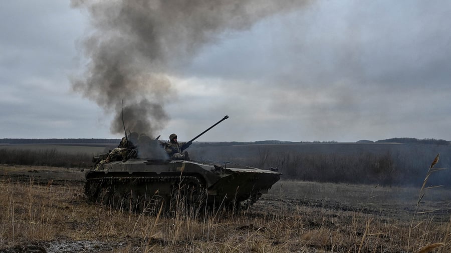 Ukrainian service members ride atop an infantry fighting vehicle during offensive and assault drills, amid Russia's attack on Ukraine, in Zaporizhzhia Region, Ukraine. Credit: Reuters File Photo