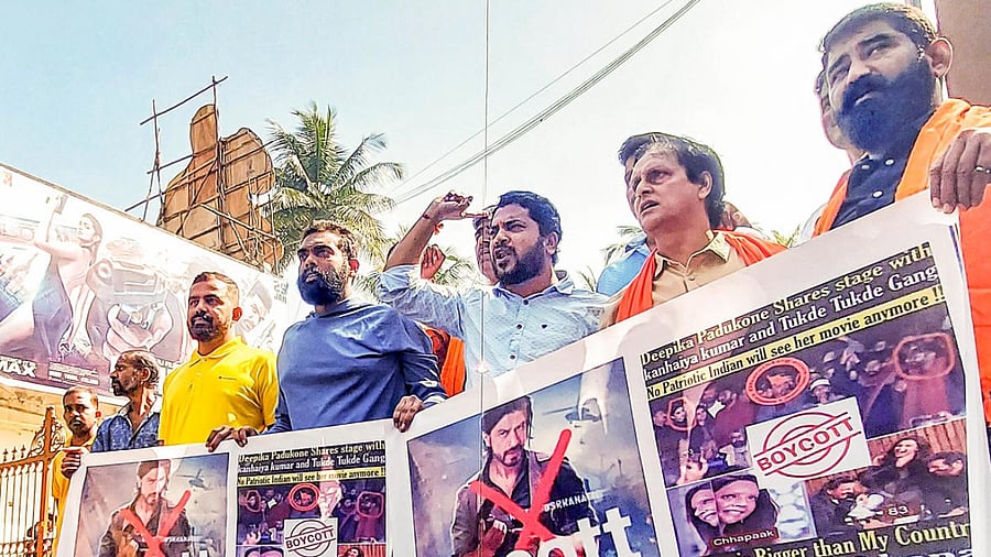 VHP members raise slogans during a protest against the release of Shah Rukh Khan's film 'Pathaan', in Bengaluru. Credit: PTI