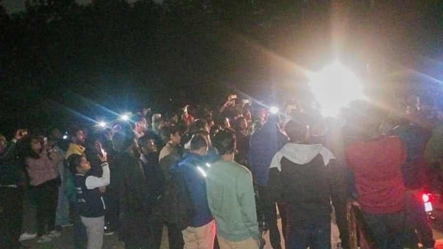 Students stand outside the JNUSU Office alleging that the JNU administration has cut off electricity supply to prevent the screening of BBC documentary ‘India: The Modi Question’. Credit: PTI Photo