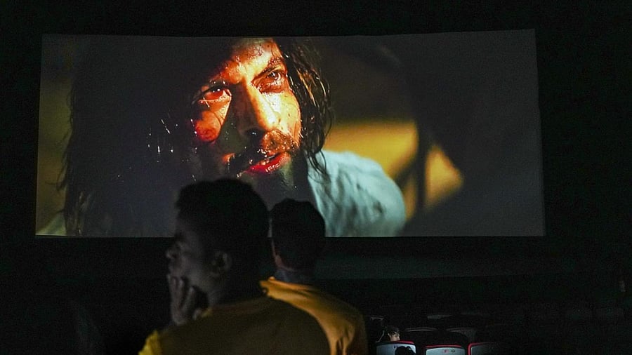 Shah Rukh Khan fans at a theatre to watch the Bollywood movie 'Pathaan', in Mumbai. Credit: PTI Photo