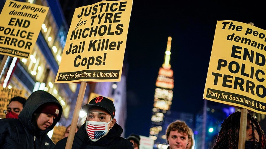 People hold placards at a protest on the day of the release of a video showing the Memphis police beating of Tyre Nichols, the young Black man who died while hospitalized three days after he was pulled over while driving by Memphis police officers, in New York. Credit: Reuters Photo