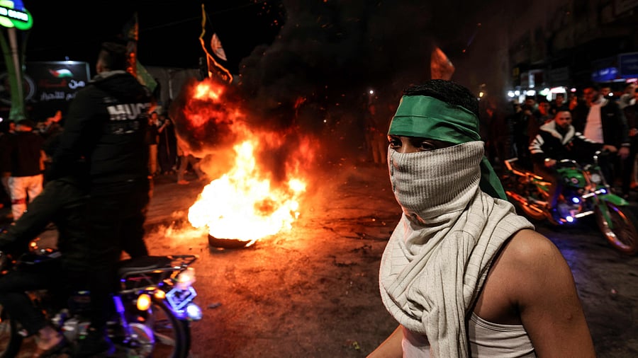 Palestinians celebrate in Gaza City on January 27, 2023, following a shooting attack by a Palestinian gunman outside an east Jerusalem synagogue. Credit: AFP Photo
