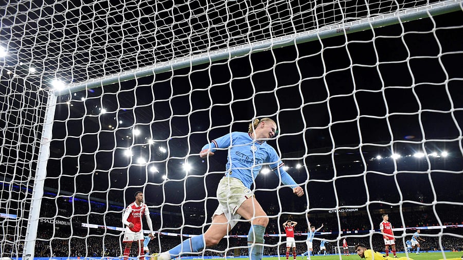 Manchester City's Norwegian striker Erling Haaland celebrates his team's goal scored by Manchester City's Dutch defender Nathan Ake during the English FA Cup fourth round football match between Manchester City and Arsenal at the Etihad Stadium in Manchester, northwest England, on January 27, 2023. Credit: AFP Photo