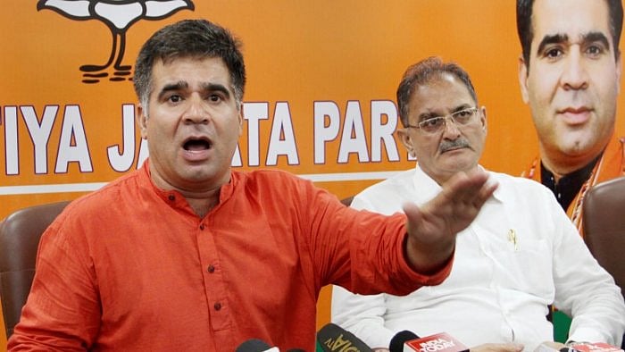 BJP State President Ravinder Raina (left) at a press conference in Jammu. Credit: PTI Photo 