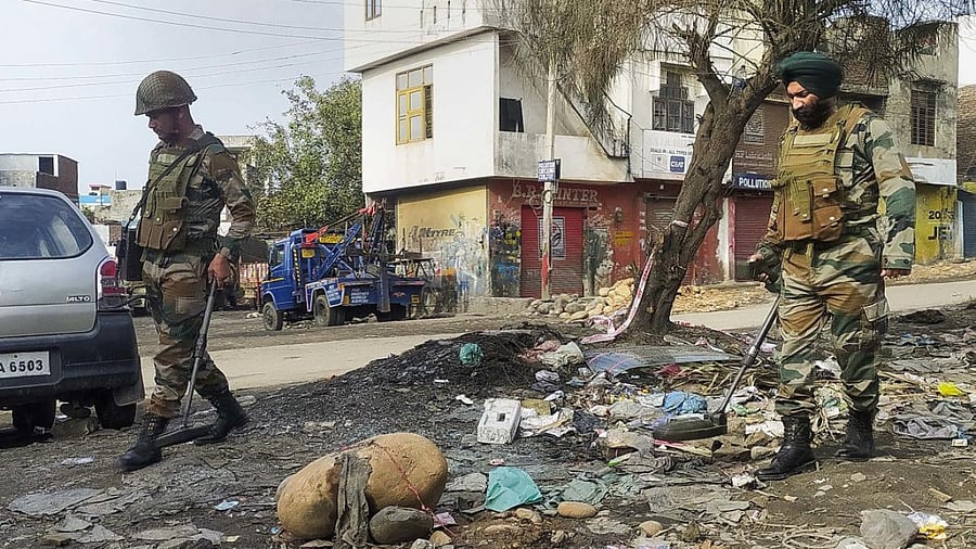 Army Personnel patrol the Narwal area after a day after the twin blast, in Jammu. Credit: PTI Photo