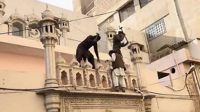 Ahmadi worship place vandalised in Karachi. Credit: IANS Photo