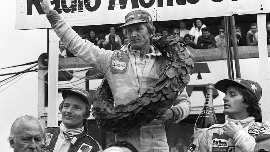 French Formula 1 driver Jean-Pierre Jabouille (C) celebrates his victory at the end of the Formula 1 Grand Prix de France in Dijon on July 1, 1979. Credit: AFP Photo