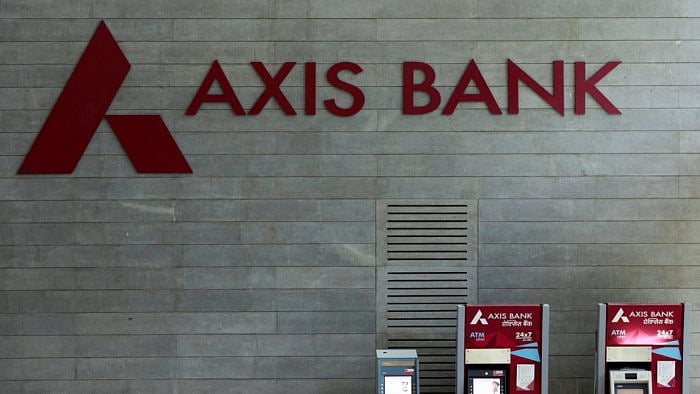 Axis Bank's logo is seen next to ATM machines at its corporate headquarters in Mumbai. Credit: Reuters Photo