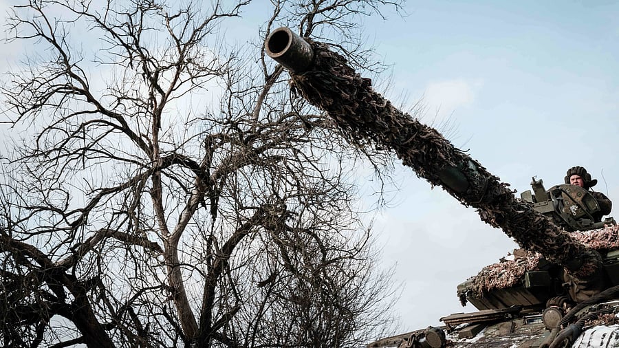 A Ukrainian service man rides on a main battle tank in Bakhmut on February 5, 2023, amid the Russian invasion of Ukraine. Credit: AFP Photo