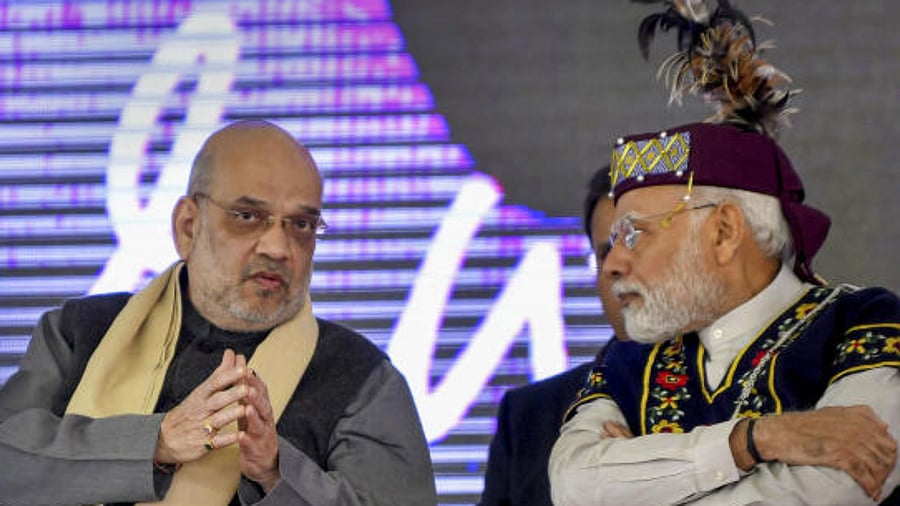 Prime Minister Narendra Modi with Union Home Minister Amit Shah during golden jubilee celebrations of the North Eastern Council, in Shillong, Meghalaya, Dec. 18, 2022. Credit: PTI Photo