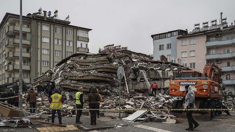 Emergency teams search for people in the rubble of a destroyed building in Gaziantep, Turkey. Credit: AP/PTI Photo