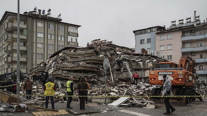 Emergency teams search for people in the rubble of a destroyed building in Gaziantep, Turkey. Credit: AP/PTI Photo