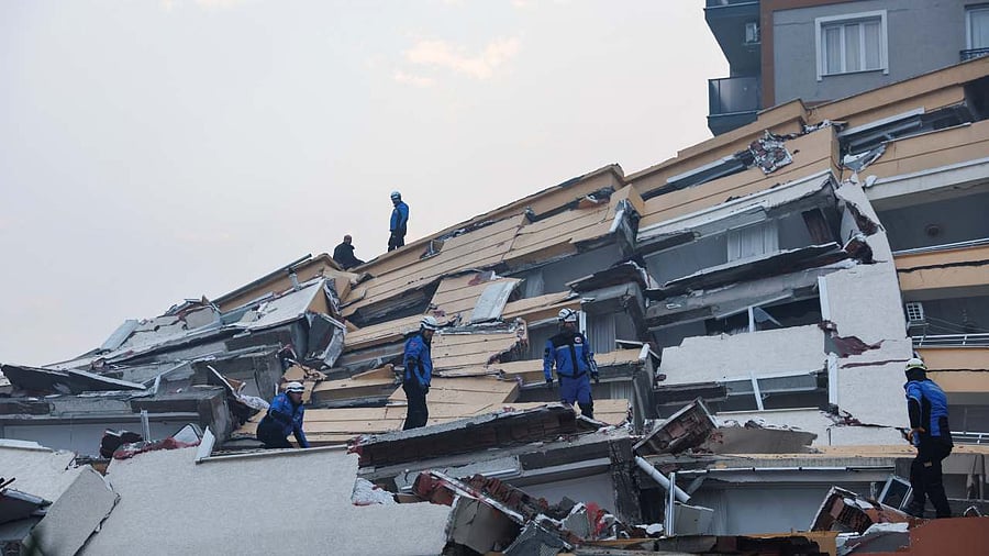 Rescuers search for survivors under the rubble following an earthquake in Hatay, Turkey. Credit: Reuters Photo