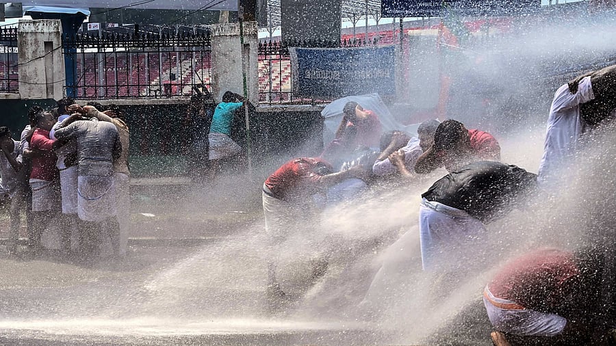 Police use water cannon to disperse the Bharatiya Janata Yuva Morcha (BJYM) activists during their protest march against the Kerala Budget, in Thiruvananthapuram, Tuesday, Feb. 7, 2023. Credit: PTI Photo