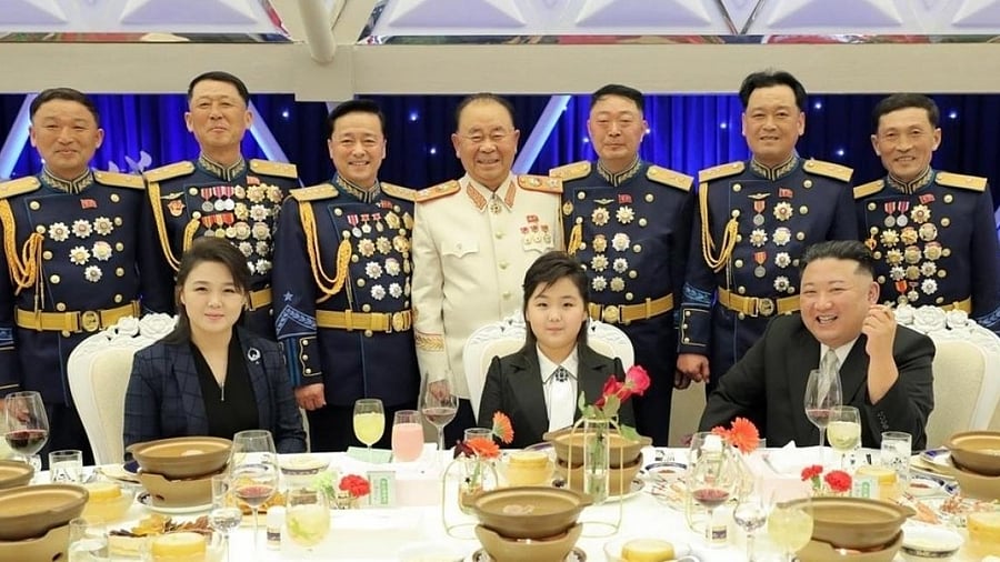 This image, captured from footage of North Korea's state-run Korean Central Television on Feb. 8, 2023, shows North Korean leader Kim Jong-un (front-R) posing for a photo with his daughter, known as Ju-ae (C), and his wife Ri Sol-ju at a banquet the previous day to mark the 75th anniversary of the founding of the armed forces. Credit: IANS Photo