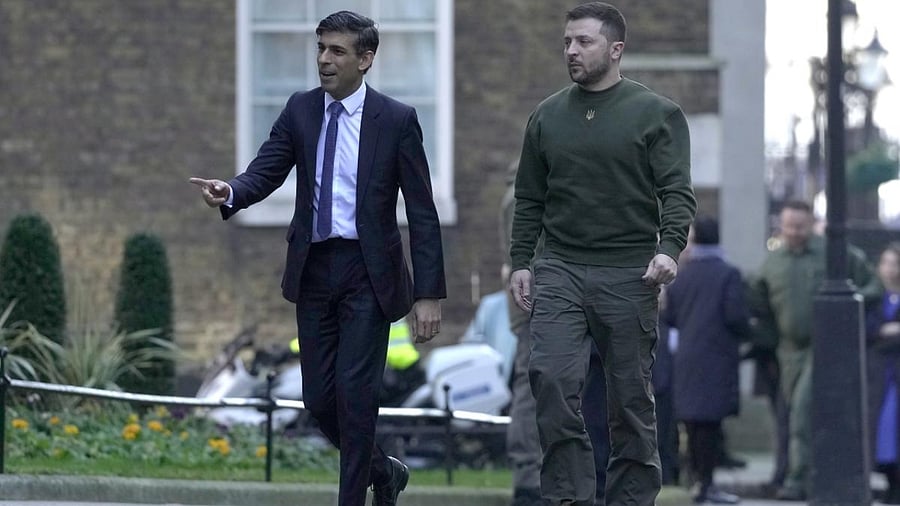 Britain's Prime Minister Rishi Sunak, left, walks with Ukraine's President Volodymyr Zelenskyy. Credit: AP/PTI Photo