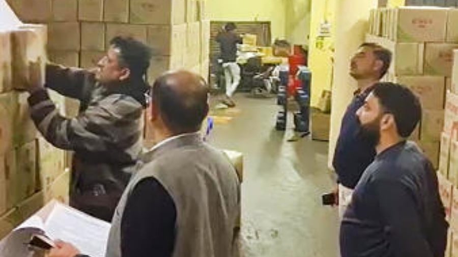 Officials of Enforcement wing of Himachal Excise and Taxation Department inspect stocks of Adani Wilmar Ltd at Parwanoo. Credit: PTI Photo