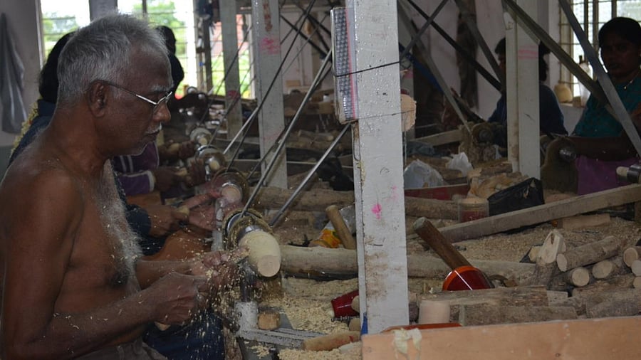 An artisan working on Channapatna toys. DH Photo