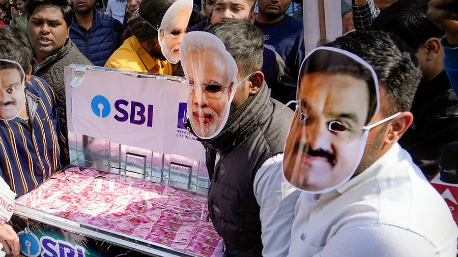 Indian Youth Congress members stage a protest against Gautam Adani and PM Modi over fraud charges alleged in Hindenberg report. Credit: PTI Photo