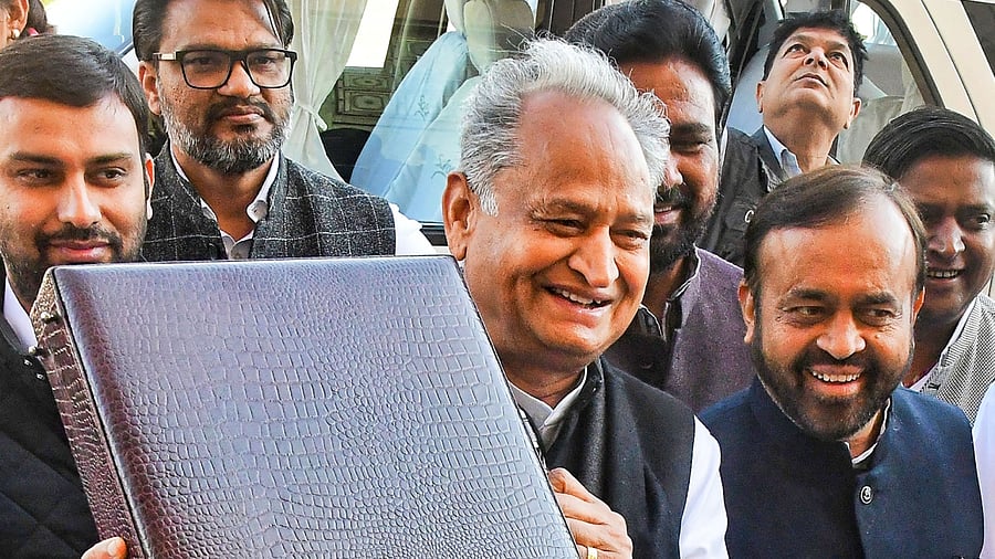 Rajasthan Chief Minister Ashok Gehlot, who also holds the finance portfolio, arrives holding the 'budget briefcase' to present the State Budget 2023-24, at Rajasthan Legislative Assembly in Jaipur, Friday, Feb. 10, 2023. Credit: PTI Photo