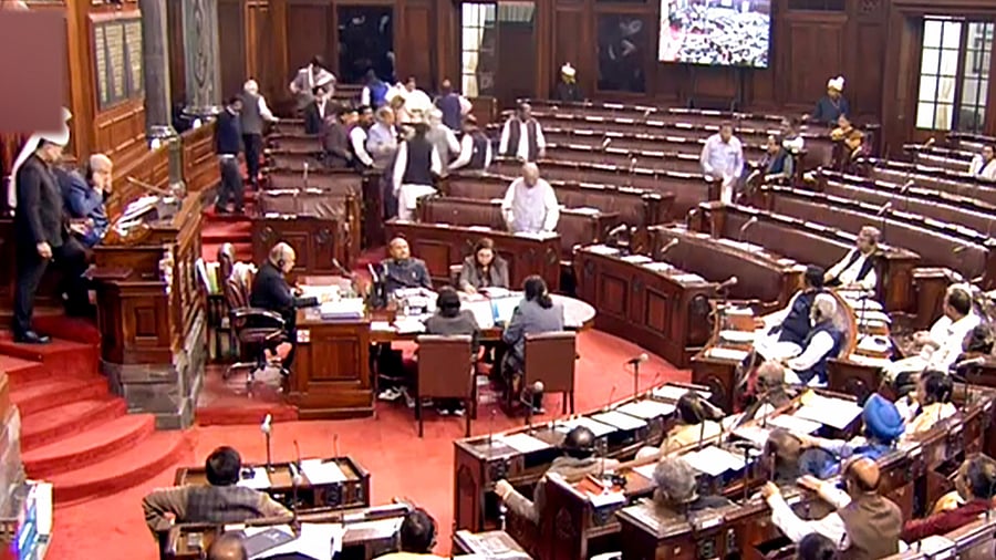 Congress and other opposition MPs stage a walkout from the Rajya Sabha during Budget Session of Parliament, in New Delhi. Credit: PTI Photo