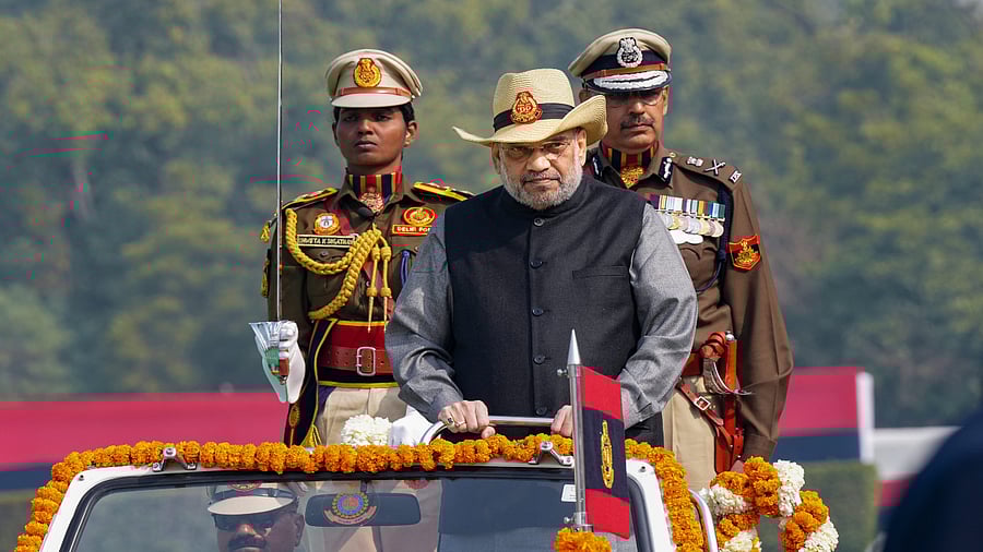 Amit Shah with Delhi Police Commissioner Sanjay Arora inspects the parade during the 76th Raising Day parade of the Delhi Police. Credit: PTI Photo