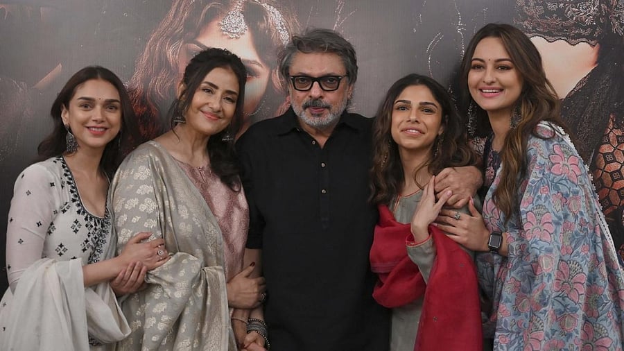 Bollywood actress Aditi Rao Hydari (1L), Manisha Koirala (L), director Sanjay Leela Bhansali (C), Sharmin Segal (R) and Sonakshi Sinha (1R) pose during the promotion of their upcoming web series ‘Heeramandi’ in Mumbai. Credit: AFP Photo