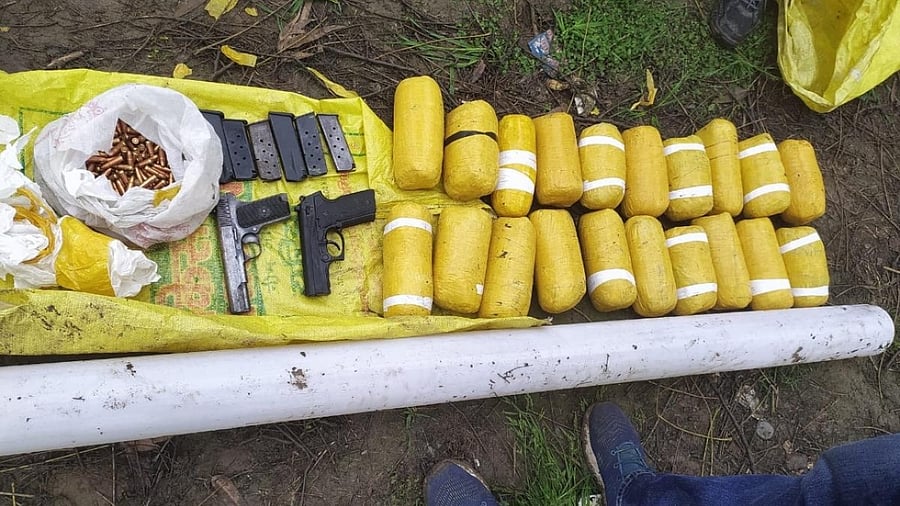 The BSF recovered 20 packets of heroin and a cache of arms and ammunition. Credit: IANS Photo