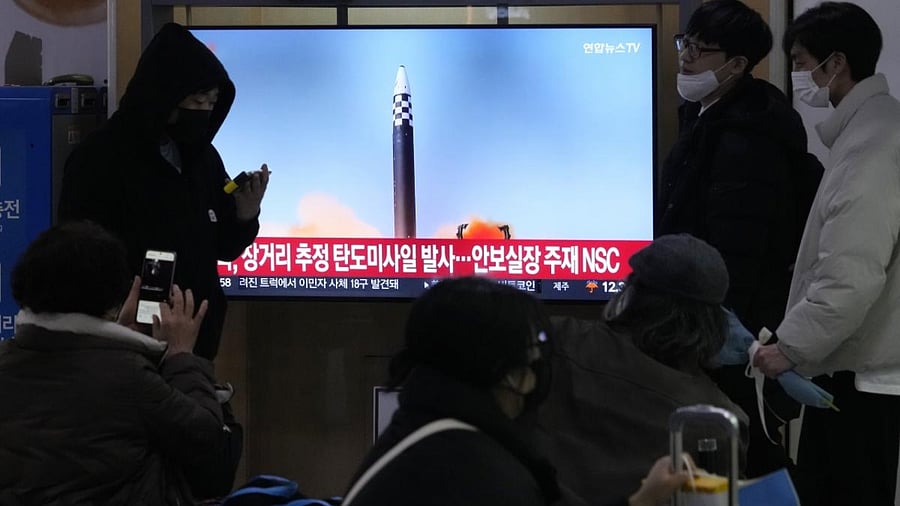 A TV screen shows a file image of North Korea's missile launch during a news program. Credit: AP/PTI Photo