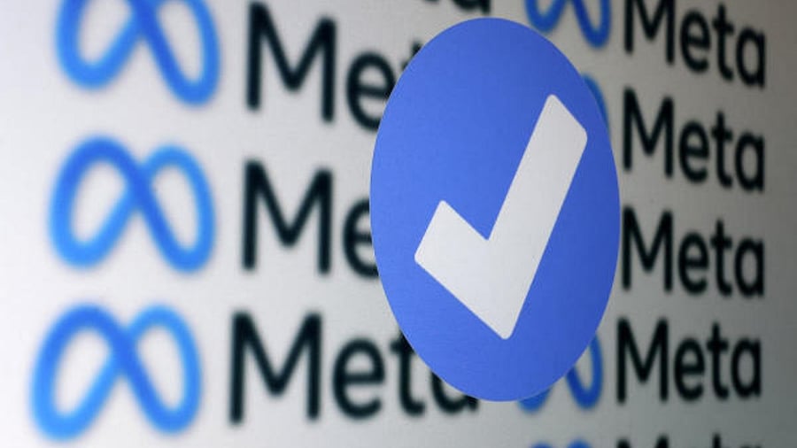 A blue verification badge and Meta logos are seen in this illustration created January 19, 2023. Credit: Reuters