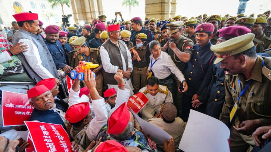 Samajwadi Party leaders stage a protest during the Budget Session of Uttar Pradesh Assembly, at Vidhan Bhawan in Lucknow. Credit: PTI Photo