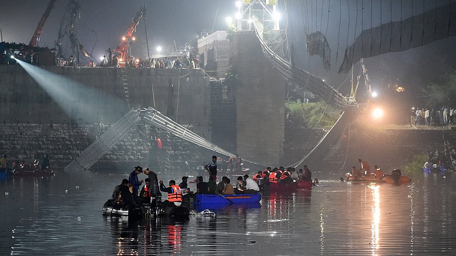 A file photo of Indian rescue personnel conducting search operations after the Morbi bridge collapse. Credit: AFP Photo