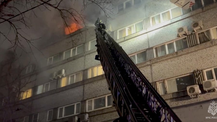 Firefighters put out a fire in the building which houses the MKM hotel in Moscow, Russia. credit: Reuters