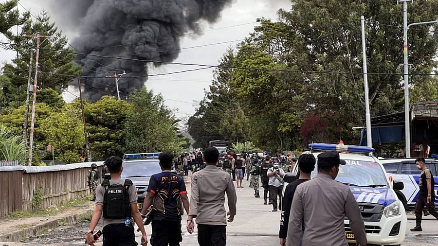 Police officers dispersing people in Wamena. Credit: AFP Photo