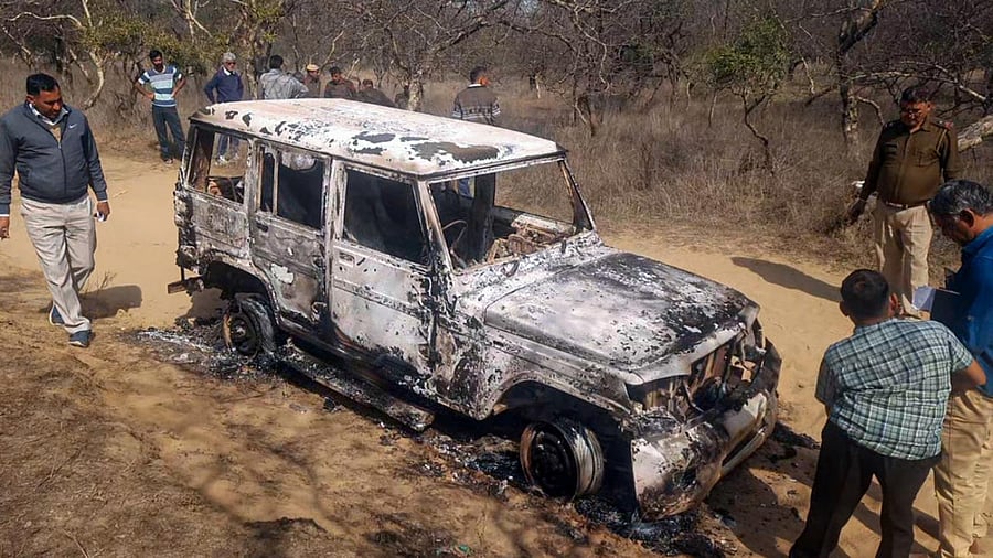 Charred remains of a vehicle where bodies of two Muslim men were found, at Loharu in Bhiwani district, Haryana. Credit: PTI Photo