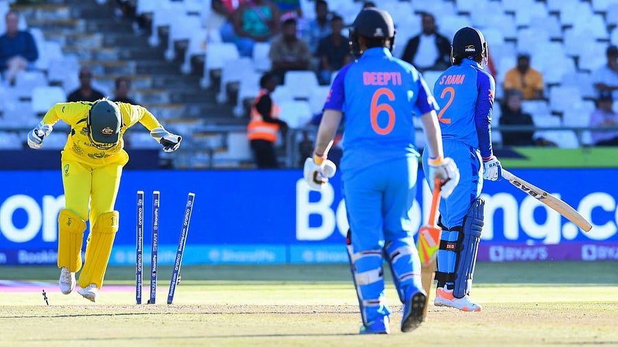 Australia's wicketkeeper Alyssa Healy (L) celebrates during the semi-final T20 women's World Cup cricket match between Australia and India at Newlands Stadium in Cape Town. Credit: AFP Photo