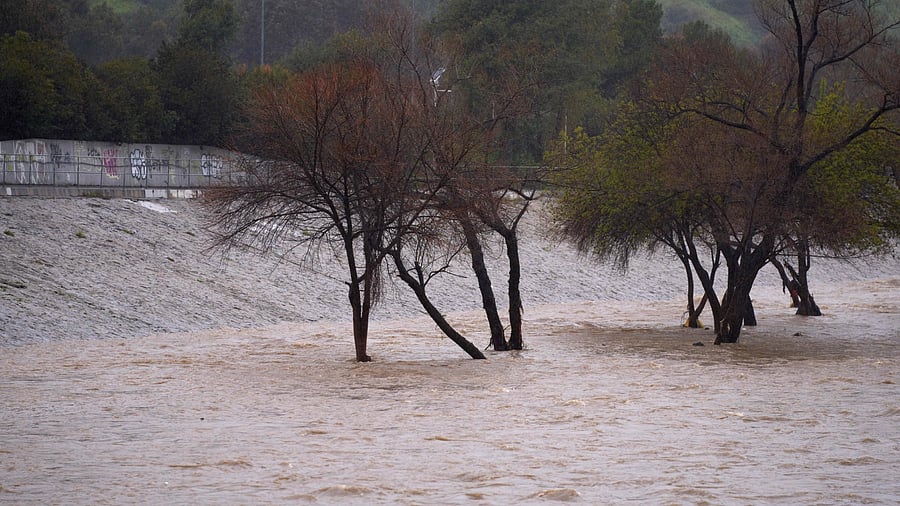 The Los Angeles River flows at a high rate due to severe rain in Los Angeles, California, on February 25, 2023. Credit: AFP Photo