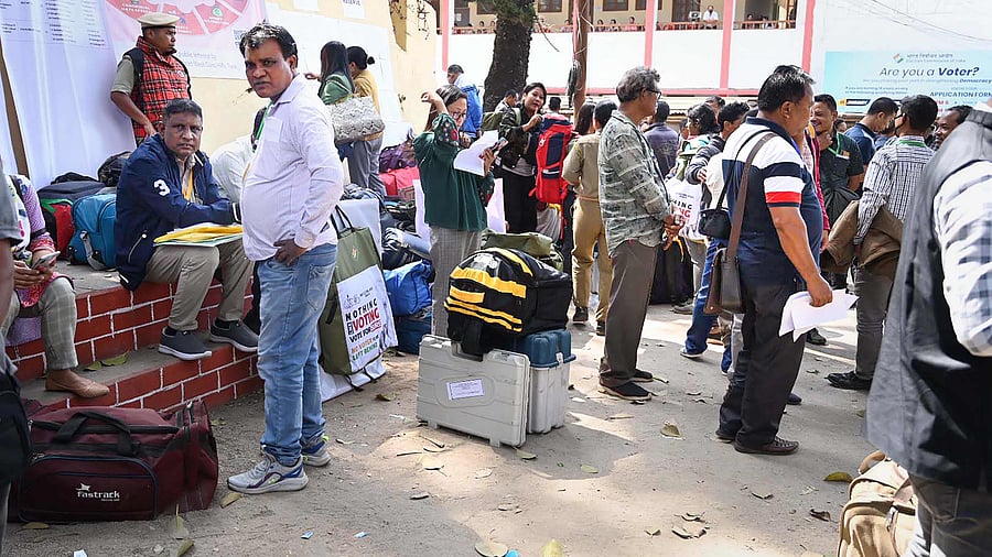 Poll officials head towards their respective polling stations for the Meghalaya Assembly elections. Credit: PTI Photo