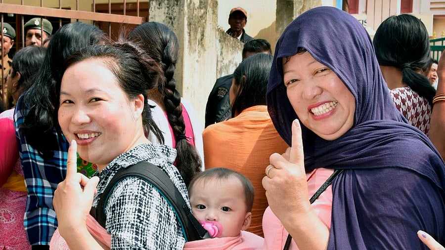 Women show their fingers marked with indelible ink after they cast their votes during 2018 Nagaland Assembly elections, in Dimapur on Tuesday. Credit: PTI Photo