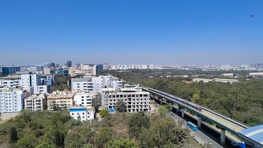 A metro train plies on the elevated track on ITPL Main Road during the recent trial run of the KR Puram-Whitefield line. Credit: Special arrangement