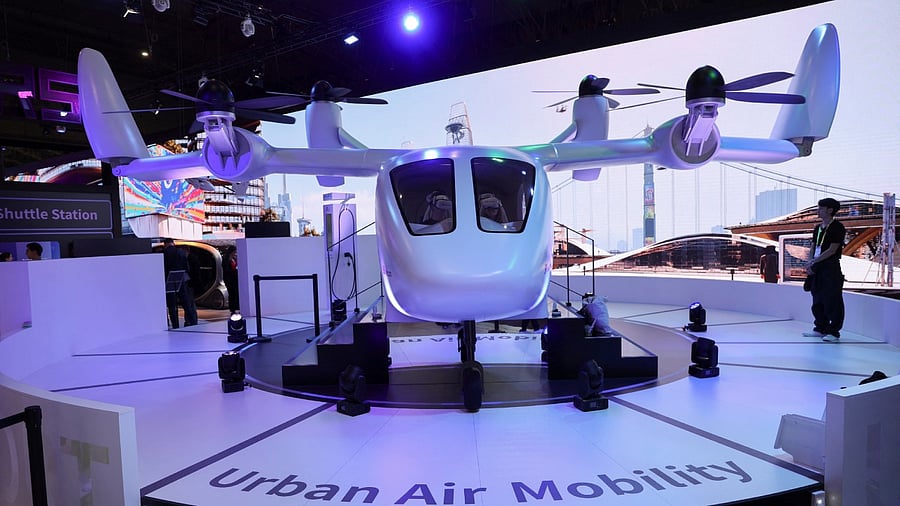 Visitors try out SK Telecom's urban air mobility simulation with virtual reality devices at the company's booth during the GSMA's 2023 Mobile World Congress (MWC) in Barcelona, Spain March 1, 2023. Credit: Reuters Photo