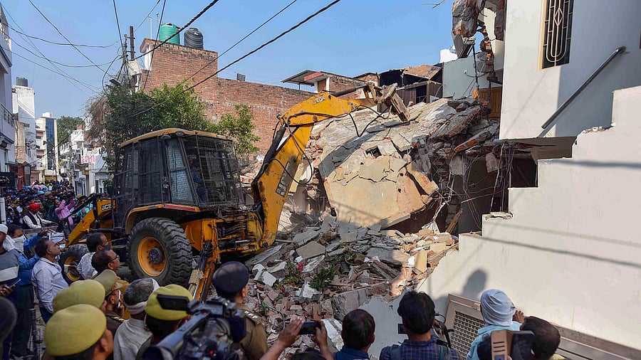 Properties of the Umesh Pal murder case accused, who were close aides of Atique Ahmad, being demolished on March 1, 2022. Credit; PTI Photo