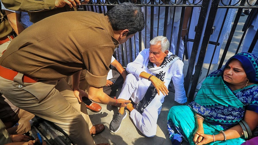 BJP MP Kirori Lal Meena with the wives of Pulwama attack's victims in Jaipur. Credit; PTI Photo