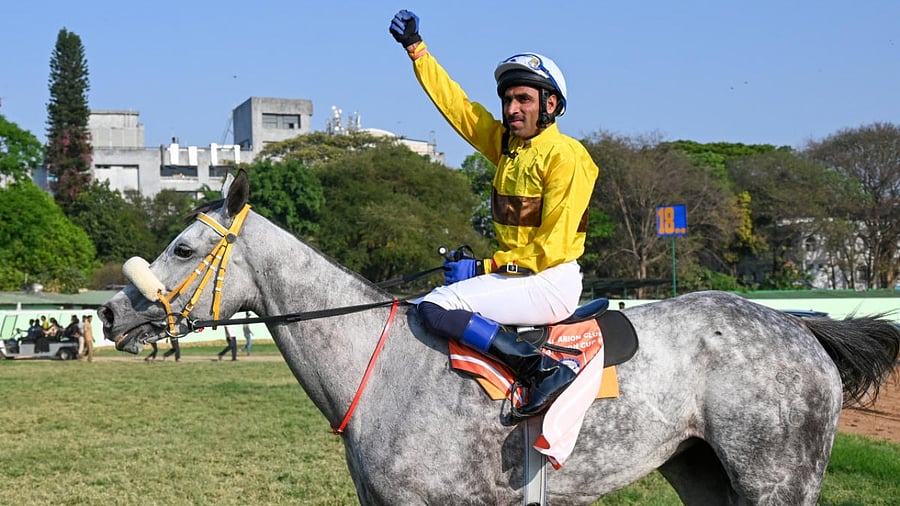 Jockey CS Jodha celebrates after leading his horse Juliette to victory in the Royal Arion Club Indian Turf Invitation Cup at the Bangalore Turf Club in Bengaluru on Sunday. Credit: DH Photo/B H Shivakumar