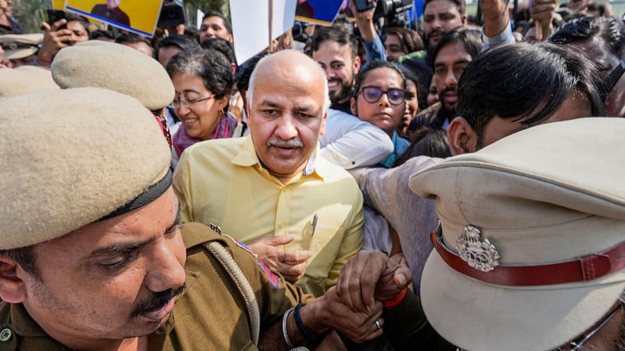  Delhi Police personnel escort Delhi Deputy Chief Minister Manish Sisodia form Rajghat ahead of his questioning by CBI in the liquor policy case, in New Delhi, Sunday, Feb. 26, 2023. Credit: PTI Photo