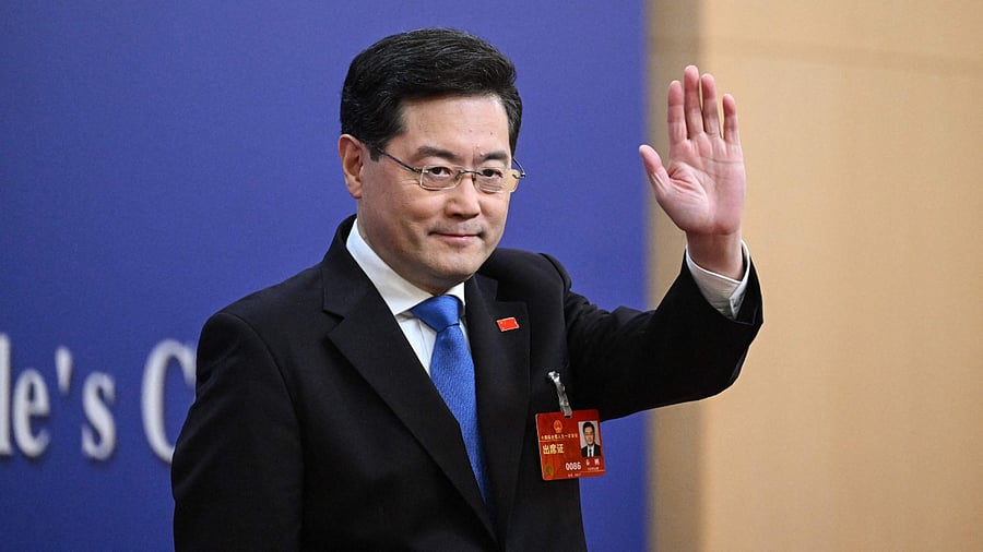 China's Foreign Minister Qin Gang waves as he arrives for a press conference at the Media Center of the National People's Congress (NPC) in Beijing on March 7, 2023. Credit: AFP Photo