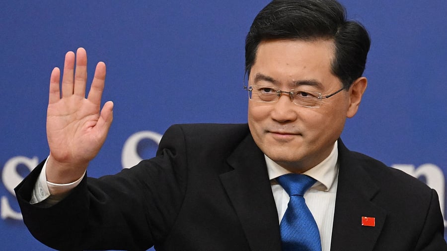 China's Foreign Minister Qin Gang waves after a press conference at the Media Center of the National People's Congress (NPC) in Beijing on March 7, 2023. Credit: AFP Photo