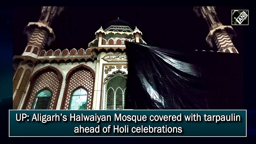 Aligarh’s Halwaiyan Mosque covered with tarpaulin ahead of Holi celebrations. Credit: Twitter/@ANI